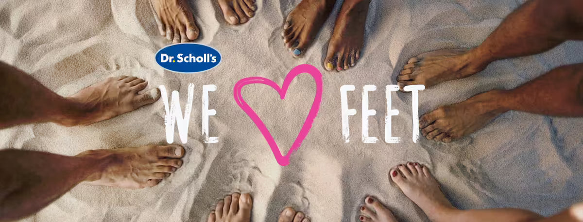 Feet of people on sand with Dr. Scholl's logo and 'We Love Feet' text.
