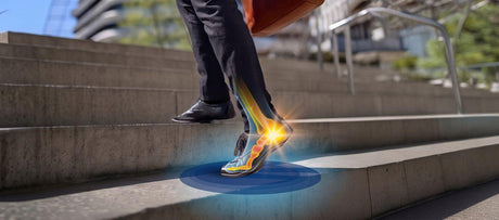 Man walking up steps with demonstrated strain from plantar fasciitis in foot.