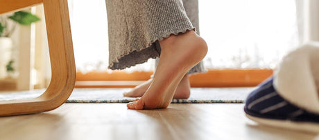 Doctor examining foot to determine source of heel pain.