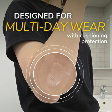 Cushioned waterproof bandage applied on upper arm over black shirt