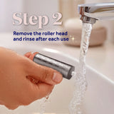 Hand rinsing Dr Scholls NanoTech Roller Replacement Head under a faucet