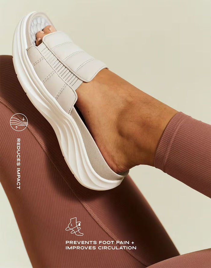 White athletic shoe being worn on a foot, with text indicating benefits on a beige background