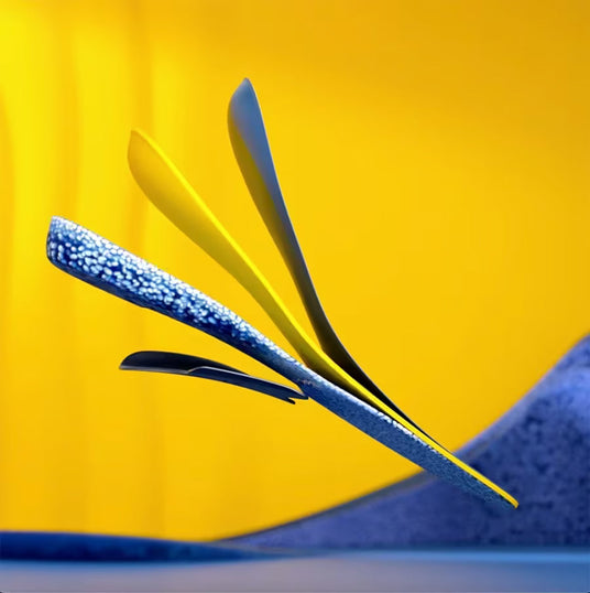 Close-up of a blue feather against a yellow background